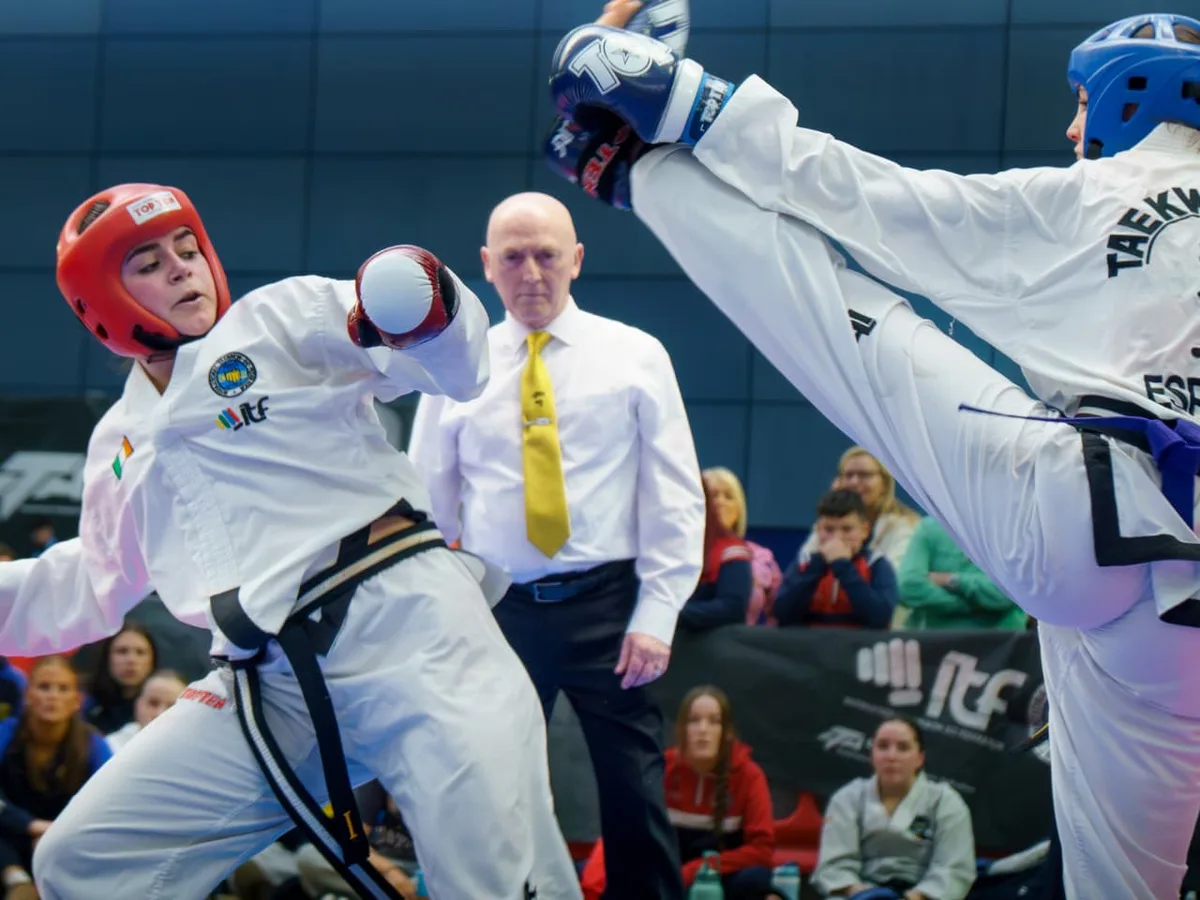 Irish competitor exchanging kicks with an international opponent